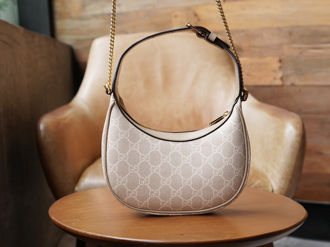 G-ucci Halbmondförmige GG Mini-Tasche