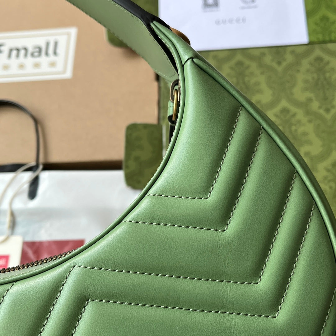 G-ucci Marmont half-moon-shaped mini bag